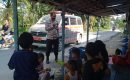Personil Polres Asahan Keliling Desa Pakai Ambulance Ajak Masyarakat di Vaksin