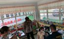 Kapolsek Medan Baru Beri Semangat Kepada Murid Saat Pelaksanaan Vaksinasi Anak Usia 6-11 Tahun